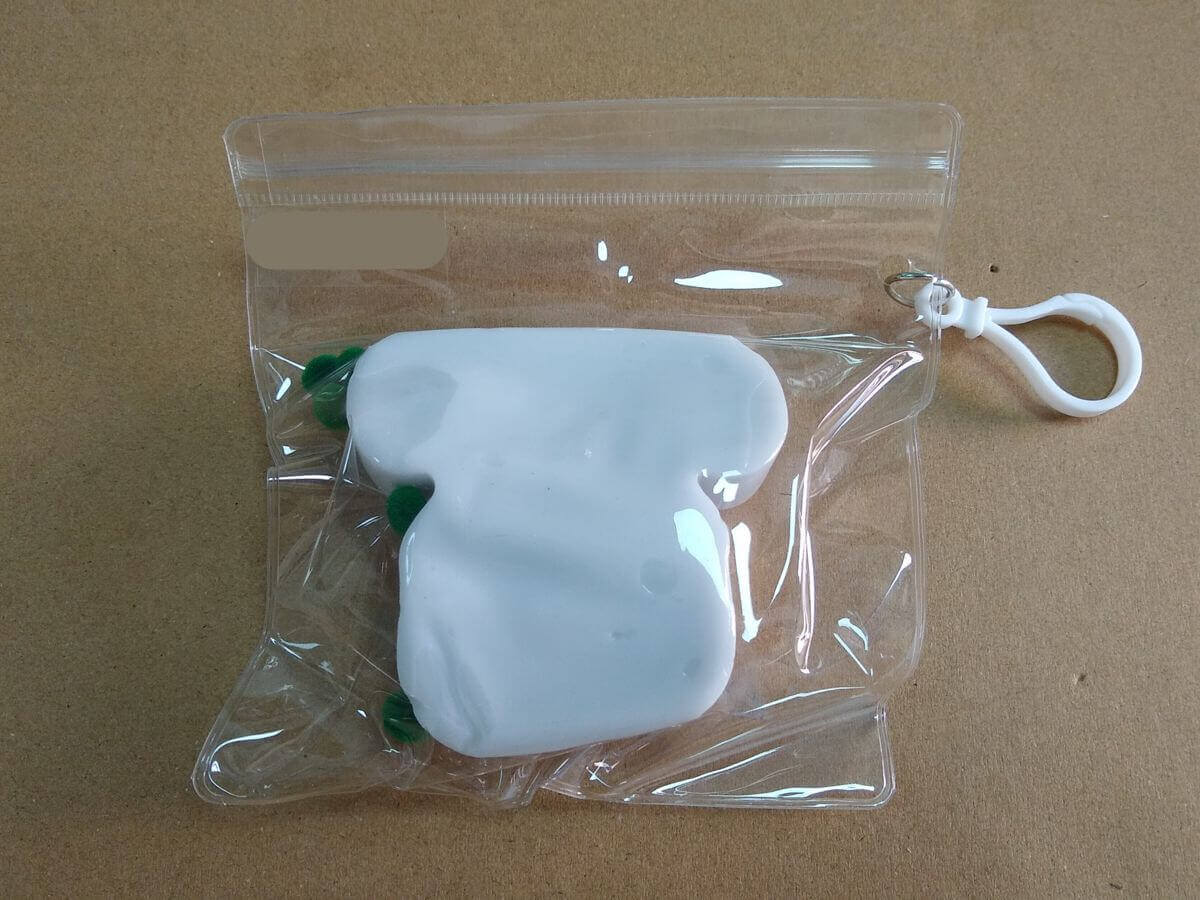 Packaging detail - all squishy toy components in direct contact inside PVC pouch