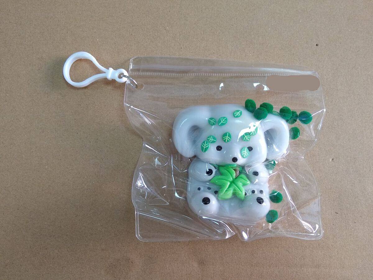 Squishy toy retail packaging - TPR koala, plastic leaves, cotton balls mixed in single PVC bag