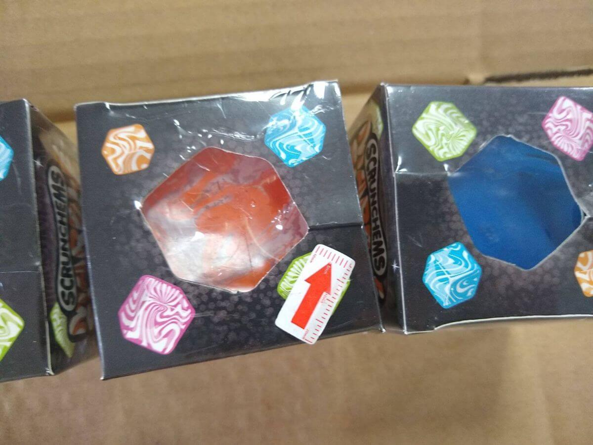 Batch view - multiple color box units showing identical window frame wrinkling
