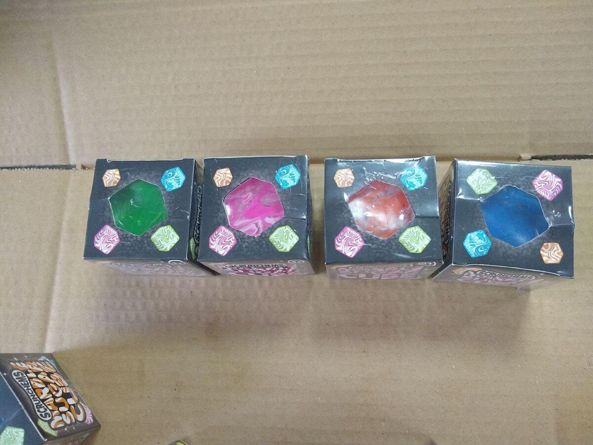 Color box wrinkle inspection - four shrink-wrapped window boxes from the pre-shipment sample