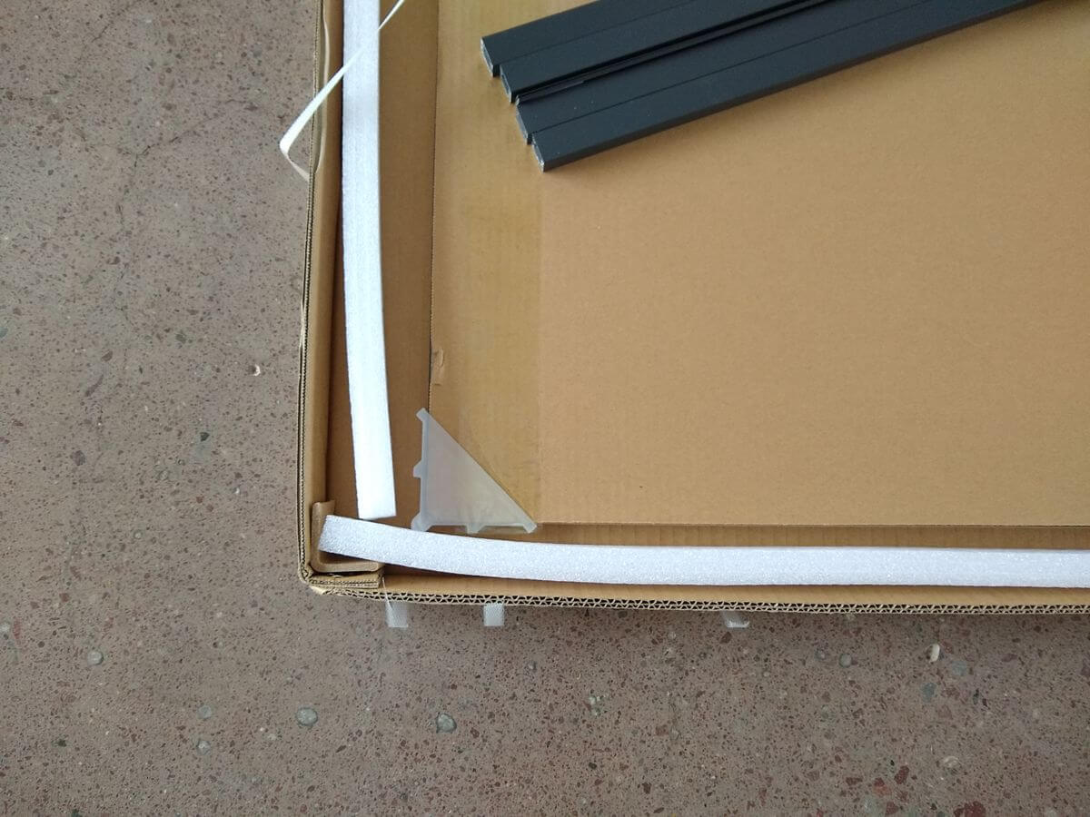 Close-up of cushioning placement in KD fence carton