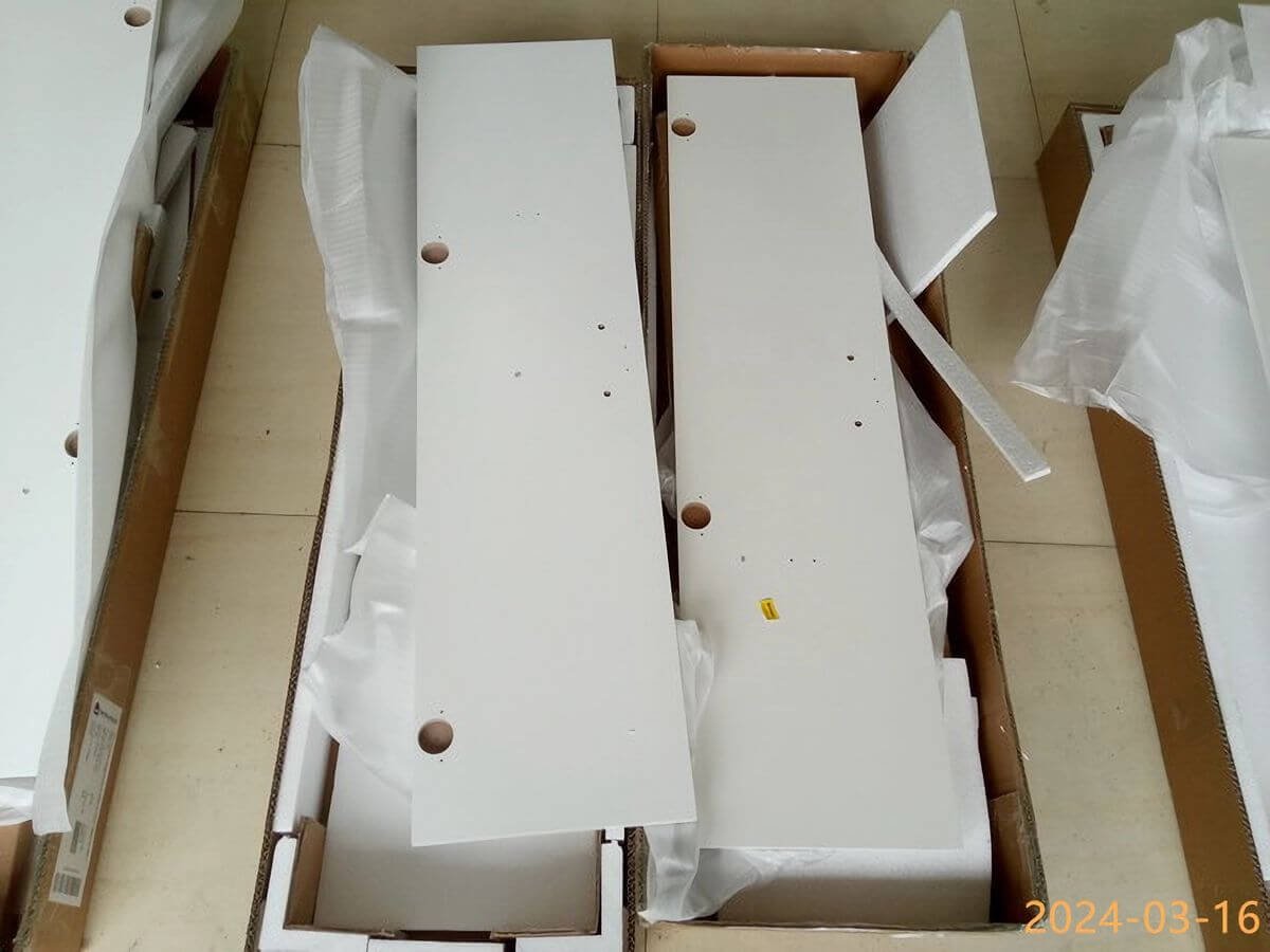 KD furniture packaging inspection showing panels and loose hardware inside