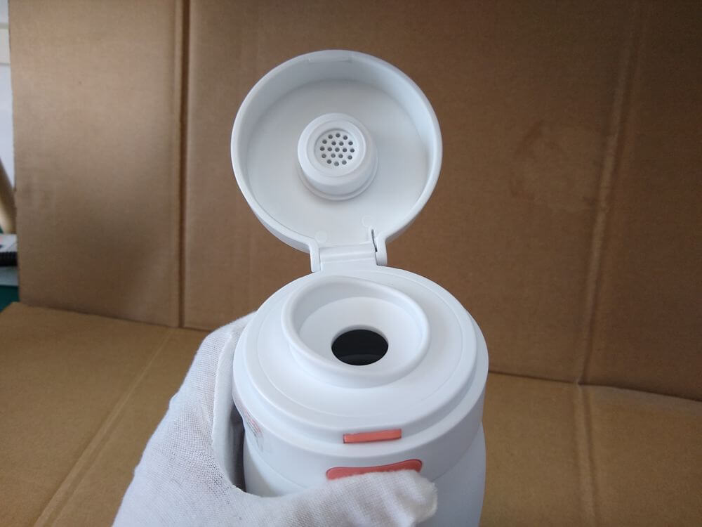 Electronic milk warmer — side profile showing the overall height and proportion