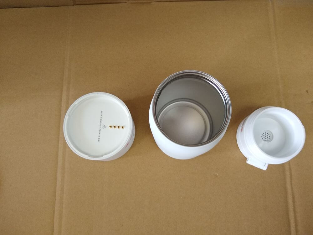 Electronic base — second disassembly step, exposing the internal PCB and battery compartment