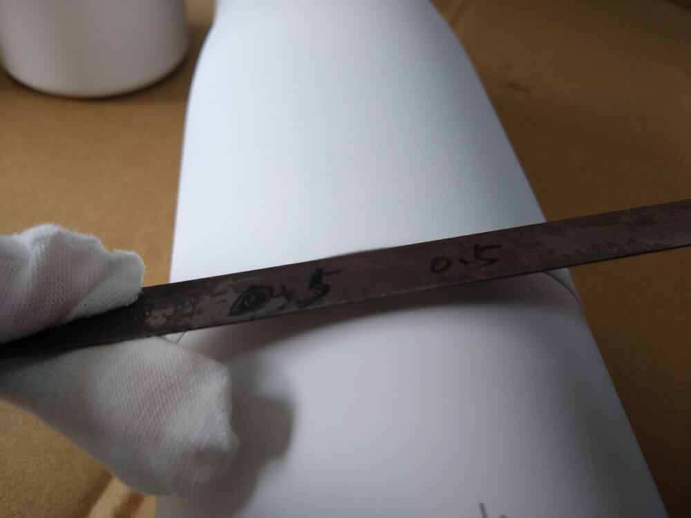 Assembly deviation — close-up measurement showing 0.7mm step at the joint