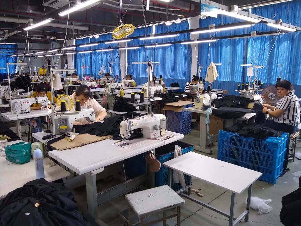 Production area — shirt manufacturing line in operation