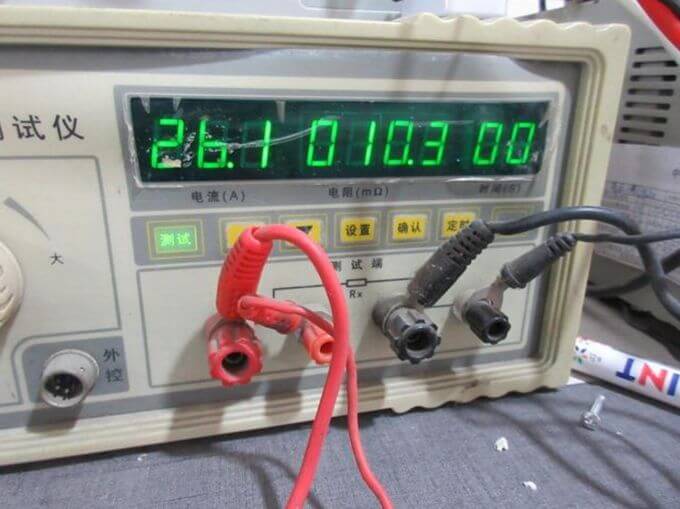 Electrical inspection in China: contact resistance test closeup on earth bonding point