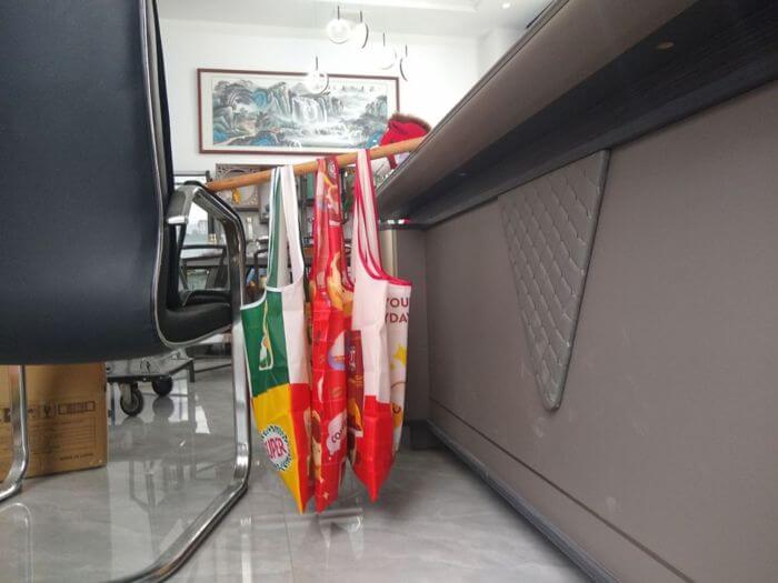 Bag inspection in China: bag held in loaded hanging position during the static load test