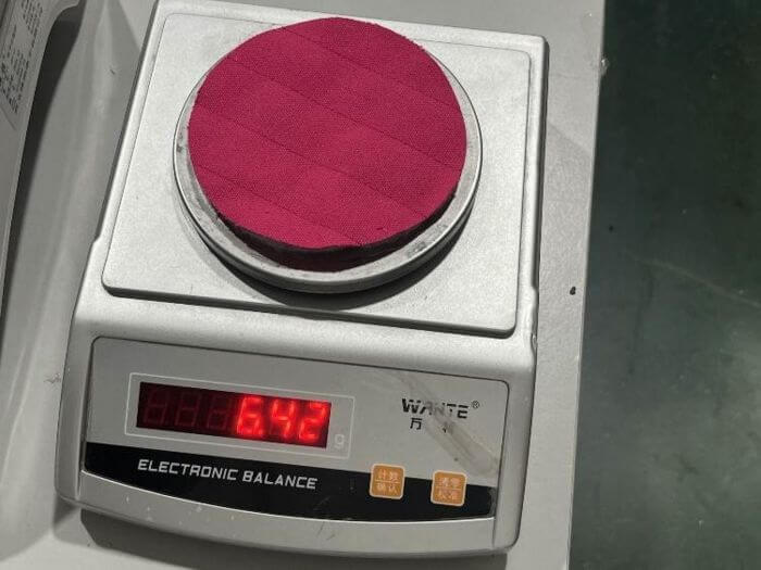 Apparel inspection in China: fabric GSM check with cutter and scale