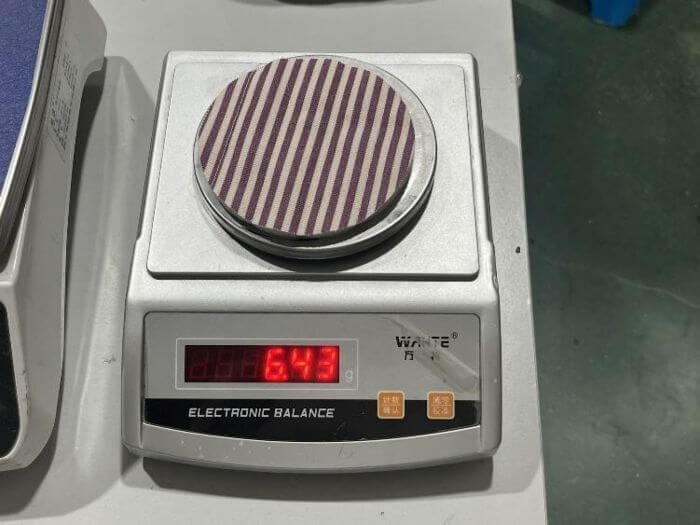 Apparel inspection in China: fabric sample weighed for GSM verification