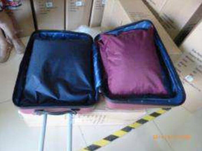 Luggage inspection in China: trolley case loaded to its declared maximum weight