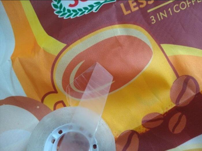 Apparel inspection in China: tape lift check on a printed logo after removal