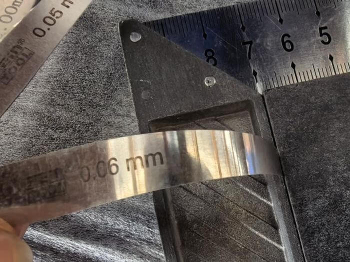 Building materials inspection in China: light gap check on slab edge against straightedge