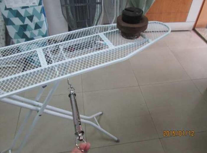 Home goods inspection in China: load and pull test on a folding ironing board