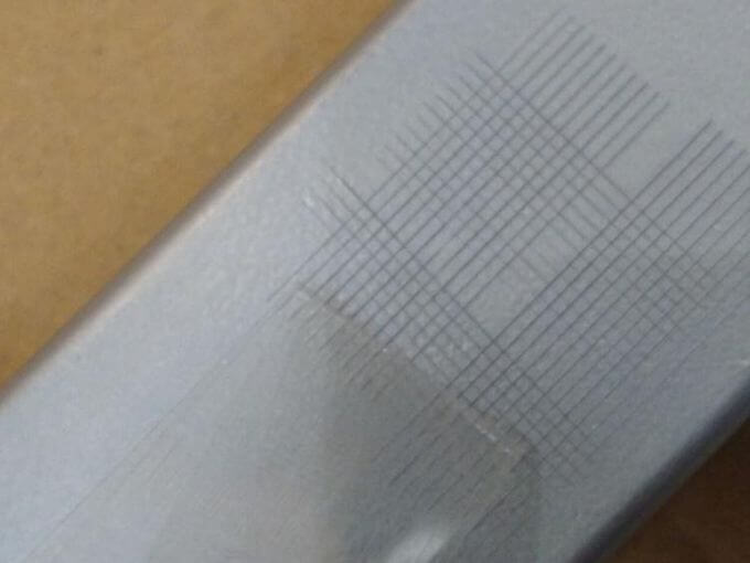 Toy inspection in China: 3M tape adhesion test on toy printing