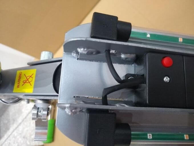 Toy inspection in China: battery lid secured with screws on a powered toy