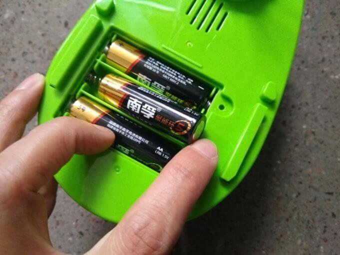 Toy inspection in China: reverse polarity battery insertion test on a toy