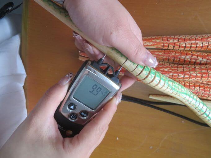 Toy inspection in China: moisture content test on a wooden toy