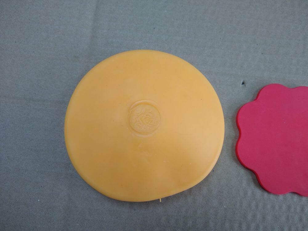 TPR Bread Squishy with Flour — side profile showing sealed edge