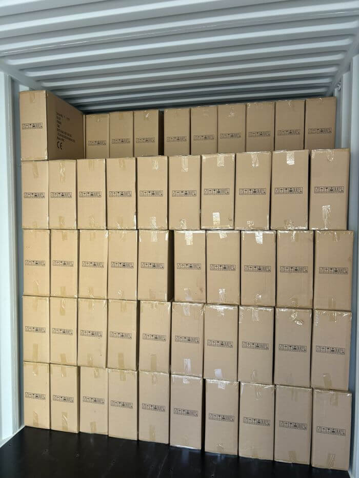 Loading supervision: container half loaded, stacking pattern visible