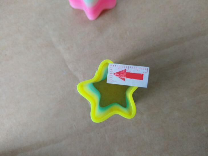 Manual rework trimming sharp edges on rainbow spring toys