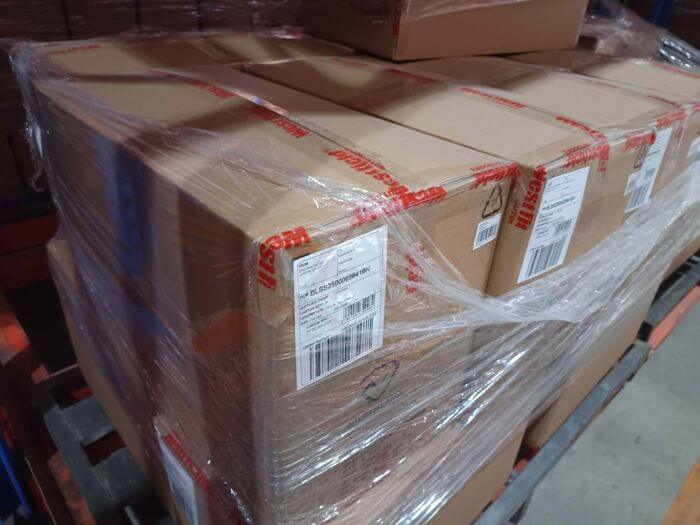 Cartons sealed with tamper-evident inspection tape after passing 100% full inspection