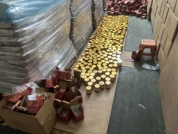 Finished goods unpacked on the factory floor for unit-by-unit full inspection