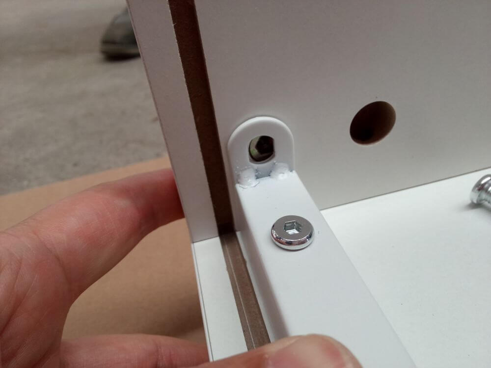 Pre-shipment inspection: screw hole misalignment on furniture panel